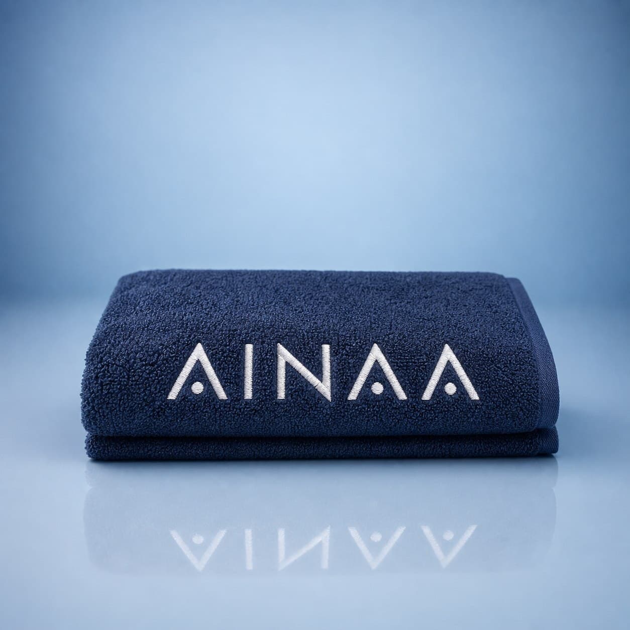 Ainaa Exclusive Face Towel — navy cotton towel with embroidered AINAA logo